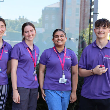 Group photo of four young volunteers.