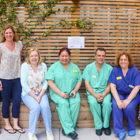 A group photo of NHS staff smiling.