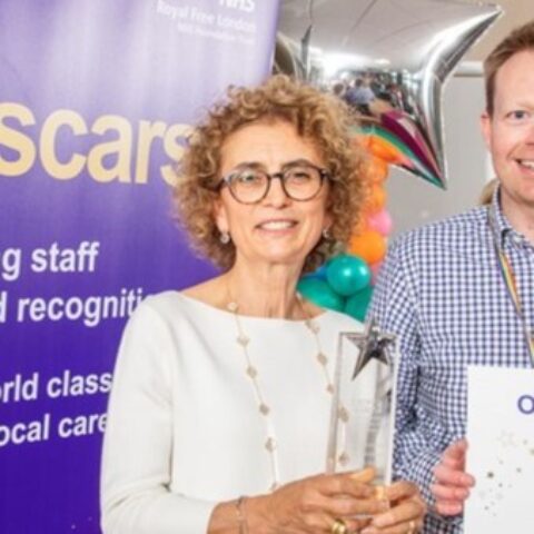 A woman smiling at the camera.