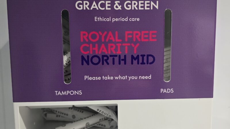 A Royal Free Charity branded dispenser for period products