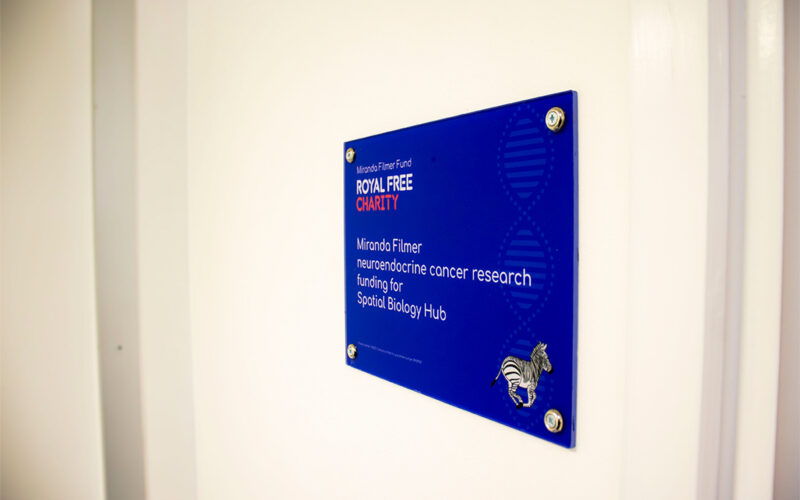 Plaque on a wall that reads: Miranda Filmer neuroendocrine cancer research funding for Spatial Biology Hub.