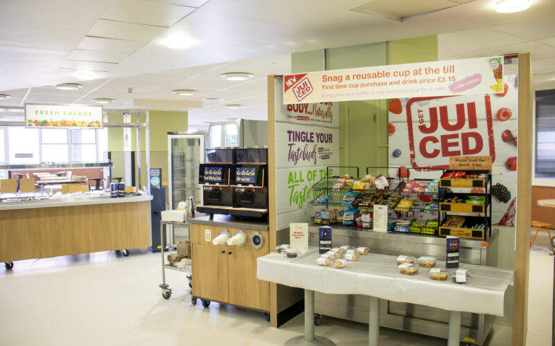 A salad bar and a snack station within a hospital restaurant.