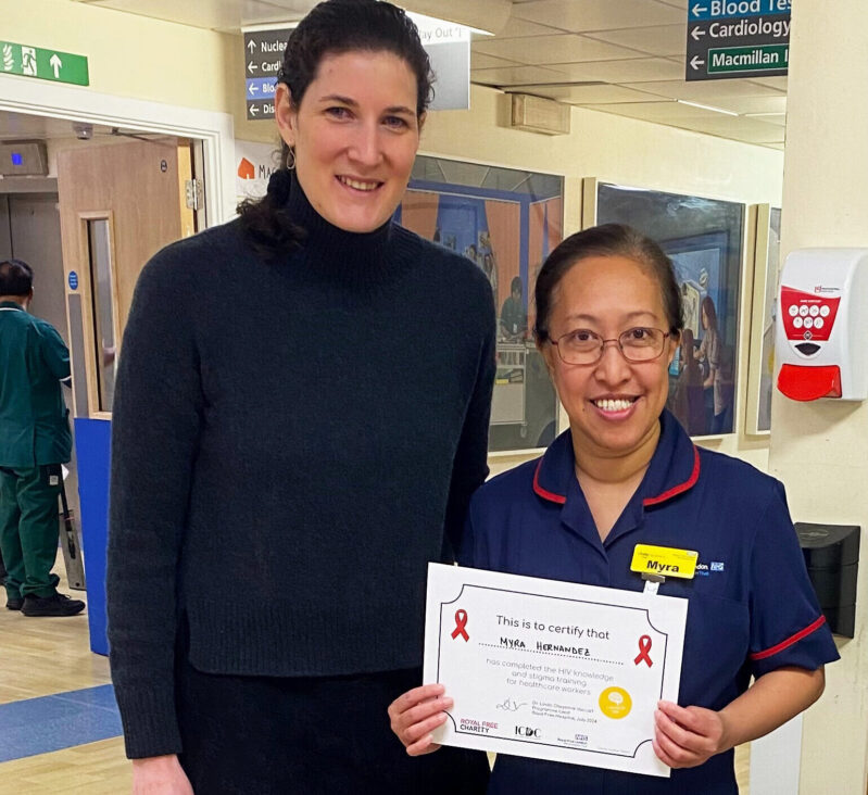 Dr. Linda Vaccari presenting a certificate of completion to a member of the Royal Free London nursing team, who holds a certificate.