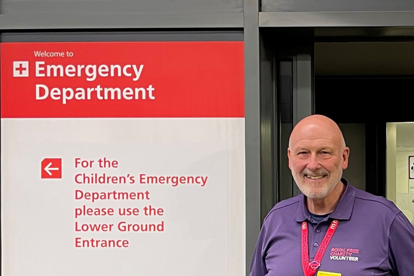 Volunteer Brian, stood outside entrance of the emergency department at the Royal Free Hospital
