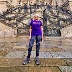 Woman stood outside in front of a cathedral wearing a Royal Free Charity t-shirt.