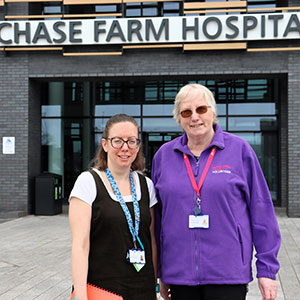 Two women stood outside Chase Farm Hospital. 